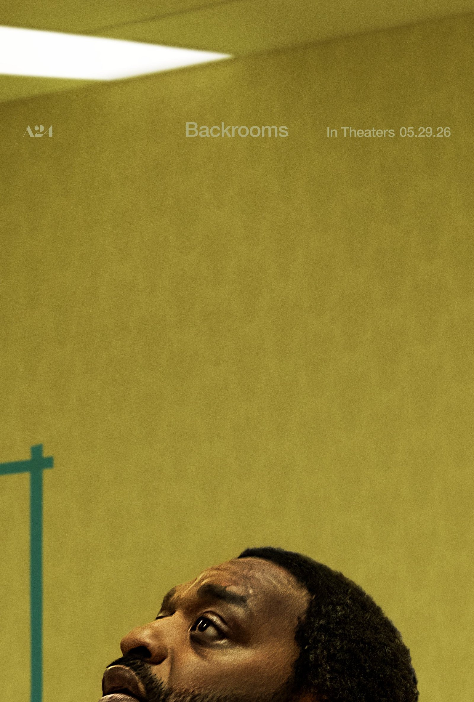 Official A24 character one-sheet: Chiwetel Ejiofor as Clark standing in a yellow Backrooms hallway